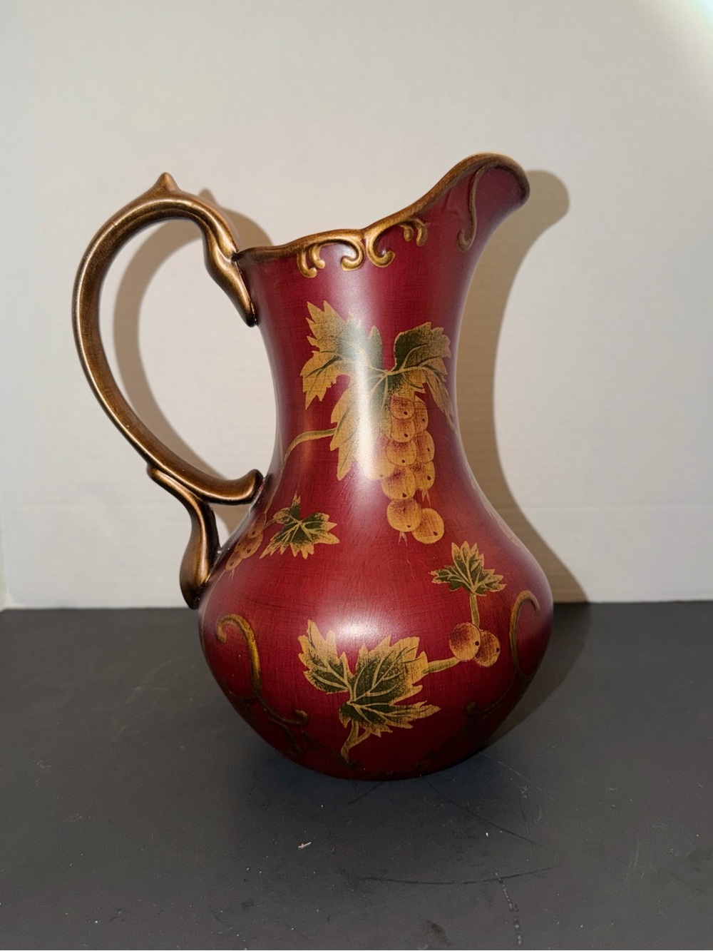 Decorative Red Ceramic Pitcher with Gold Handle and Grape Motif